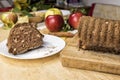 Sliced apple cinnamon bread. with decorations on wooden table. Made from apples, sugar, oil, eggs, flour. Homemade apple loaf cake Royalty Free Stock Photo