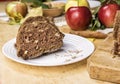 Sliced apple cinnamon bread. with decorations on wooden table. Made from apples, sugar, oil, eggs, flour. Homemade apple loaf cake