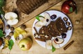 Sliced apple cinnamon bread. with decorations on wooden table. Made from apples, sugar, oil, eggs, flour. Homemade apple loaf cake Royalty Free Stock Photo