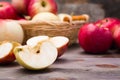 Sliced apple and ripe red apples on a wooden table and in a basket Royalty Free Stock Photo