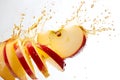 Sliced of apple with splashing juice on white background Royalty Free Stock Photo