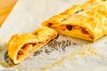 Sliced apple strudel on baking paper Royalty Free Stock Photo