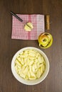 Sliced apples for an apple pie with peel and cinnamon