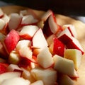 Sliced apples. Apple pieces. Red cut apple for pie close-up. Selective focus Royalty Free Stock Photo