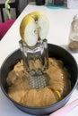 Sliced apples and dough in a baking dish. Charlotte ingredients and tools. Autumn pie with apples