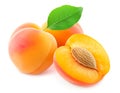 Sliced apricots with seed and leaf isolated on white Royalty Free Stock Photo