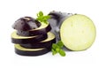 Sliced aubergine, eggplant with basil leaves isolated white Royalty Free Stock Photo