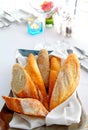 Sliced baguette with kitchenware