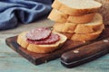 Sliced baguette with salami Royalty Free Stock Photo