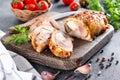 Sliced baked until golden, crispy crust chicken roll, stuffed with cheese, herbs and mushrooms, garnish of vegetables Royalty Free Stock Photo