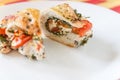 Sliced baked poultry fillet stuffed with soft cheese, tomatoes a Royalty Free Stock Photo