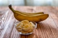 Sliced banana in bowl on wooden table Royalty Free Stock Photo