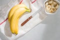 A sliced banana in a bowl on wooden background Royalty Free Stock Photo