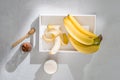 A sliced banana in a bowl on wooden background Royalty Free Stock Photo