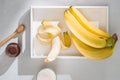 A sliced banana in a bowl on wooden background Royalty Free Stock Photo