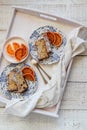 Sliced banana cake served with blood oranges on a white tray. Royalty Free Stock Photo