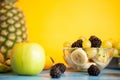 Sliced banana, grapes, kiwi and berry in a bowl