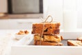 Sliced banana nut bread. Cake with nuts on wooden board with glass of milk. Morning breakfast background. Baked home desert. Close Royalty Free Stock Photo