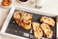 Sliced banana nut bread. Cake with nuts on wooden board. Morning breakfast background. Baked home desert. Close up view Royalty Free Stock Photo