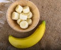 Sliced banana ,top view on white wooden background Royalty Free Stock Photo