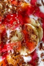 Sliced banana in whipped cream fruit dessert macro shot