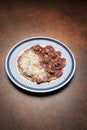 Sliced beef and avocado with grated cheese