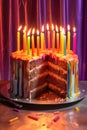 sliced birthday cake with lit candles