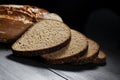 Sliced black bread on wooden table Royalty Free Stock Photo