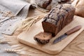 Sliced black bread on a wooden table Royalty Free Stock Photo