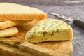 Sliced blue cheese and bread on wooden cutting board Royalty Free Stock Photo