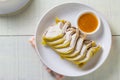 Sliced boiled chicken with fish sauce on white plate Royalty Free Stock Photo