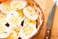Sliced boiled eggs with dill, kitchen knife close-up Royalty Free Stock Photo