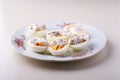 Sliced boiled eggs with mayonnaise and pepper in white plate isolated Royalty Free Stock Photo