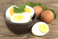 Sliced boiled eggs, with parsley leaves. Cooking a salad with boiled eggs Royalty Free Stock Photo