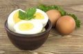 Sliced boiled eggs, with parsley leaves. Cooking a salad with boiled eggs Royalty Free Stock Photo