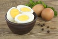 Sliced boiled eggs, with parsley leaves. Cooking a salad with boiled eggs Royalty Free Stock Photo