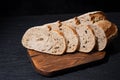 Sliced bread on cutting board. Slices of grain bread Royalty Free Stock Photo