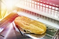 Sliced bread in cutting machine Royalty Free Stock Photo