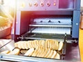 Sliced bread in cutting machine Royalty Free Stock Photo