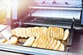 Sliced bread in cutting machine Royalty Free Stock Photo