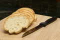 Sliced bread with knife oblique