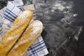 Sliced bread over dark stone table. View from above with copy space. fresh baked French baguette Royalty Free Stock Photo