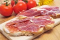 Sliced of bread with serrano ham served as tapas Royalty Free Stock Photo