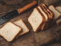 Sliced Bread stock image with wooden background.