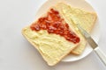 Sliced bread with strawberry jam and butter. Royalty Free Stock Photo