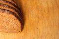 Sliced bread on a wooden cutting board