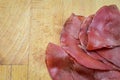 Sliced bresaola, delicious typical italian raw beef salami, close up