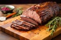 sliced brisket on a wooden board