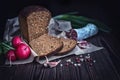 Sliced brown bread, salami, radish, garlic, green onions and dry Royalty Free Stock Photo