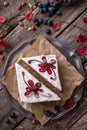 Sliced cake with wild berries and chocolate. Royalty Free Stock Photo